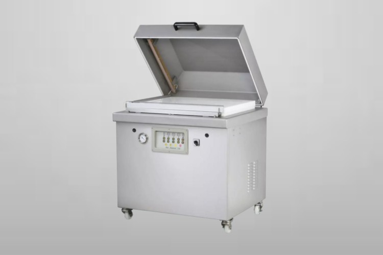 Single chamber vacuum packaging machine