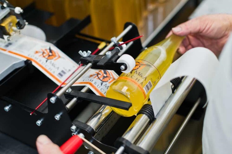Improve the Performance of A Manual Bottle Labeler
