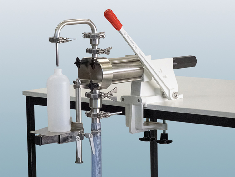 Manual container filling machines